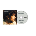 Tom Grennan 'Wrapped in Gold' CD album with the square cover art on the left and the silver CD disc on the right, shown on a plain white background.